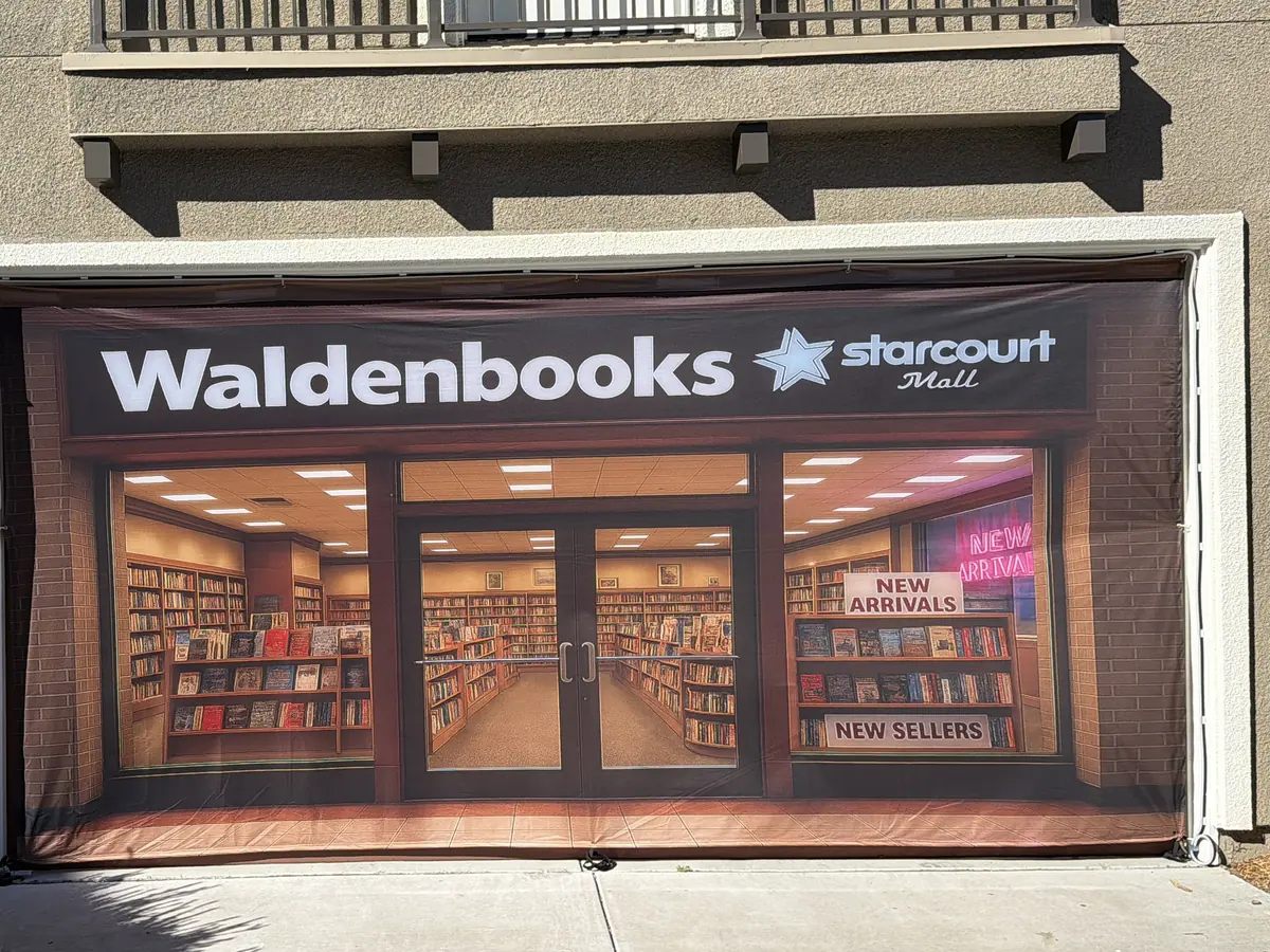 A Waldenbooks storefront with Starcourt Mall branding, printed full-size over a garage door.